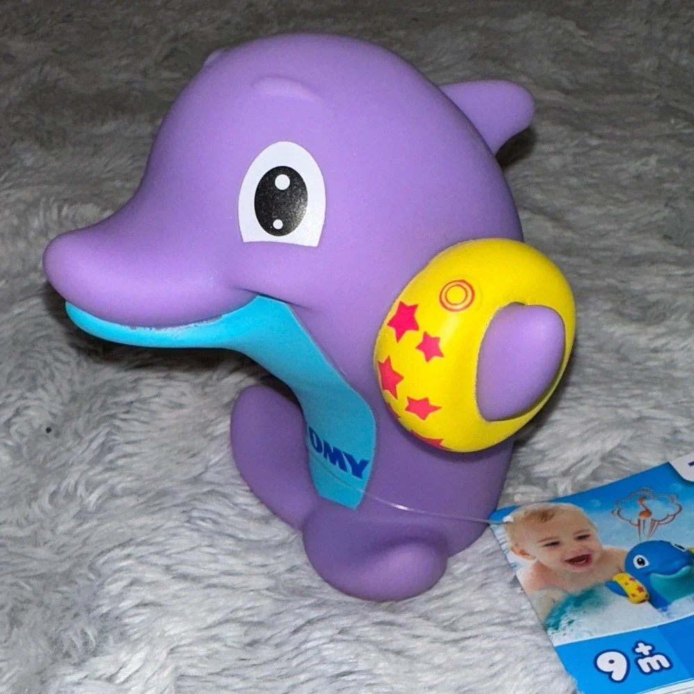 TOMY Water Whistlers Purple Dolphin Bath Toy E72379 Squirter Whistle 9m+